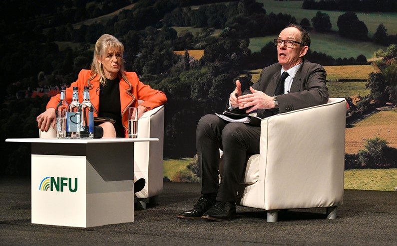 A picture of Sir David Ramsden CBE in discussion with NFU President Minette Batters at NFU Conference 2022
