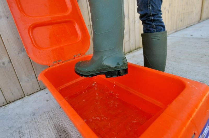 Person washing their wellies