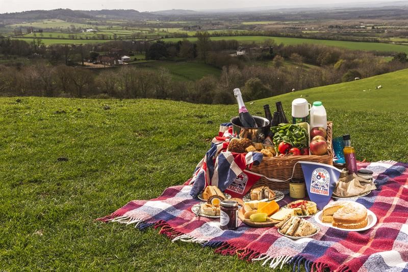 A picture of a picnic with the British countryside in the background