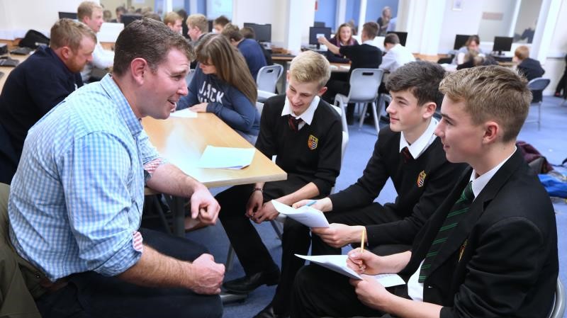 An image of secondary school students asking questions at a careers event in Teesdale the North East of England