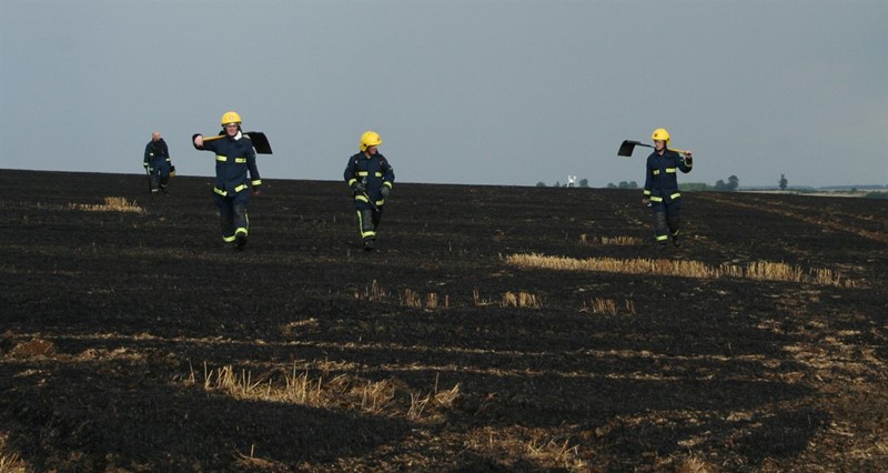 Firemen returning from tackling a farmland fire_77548