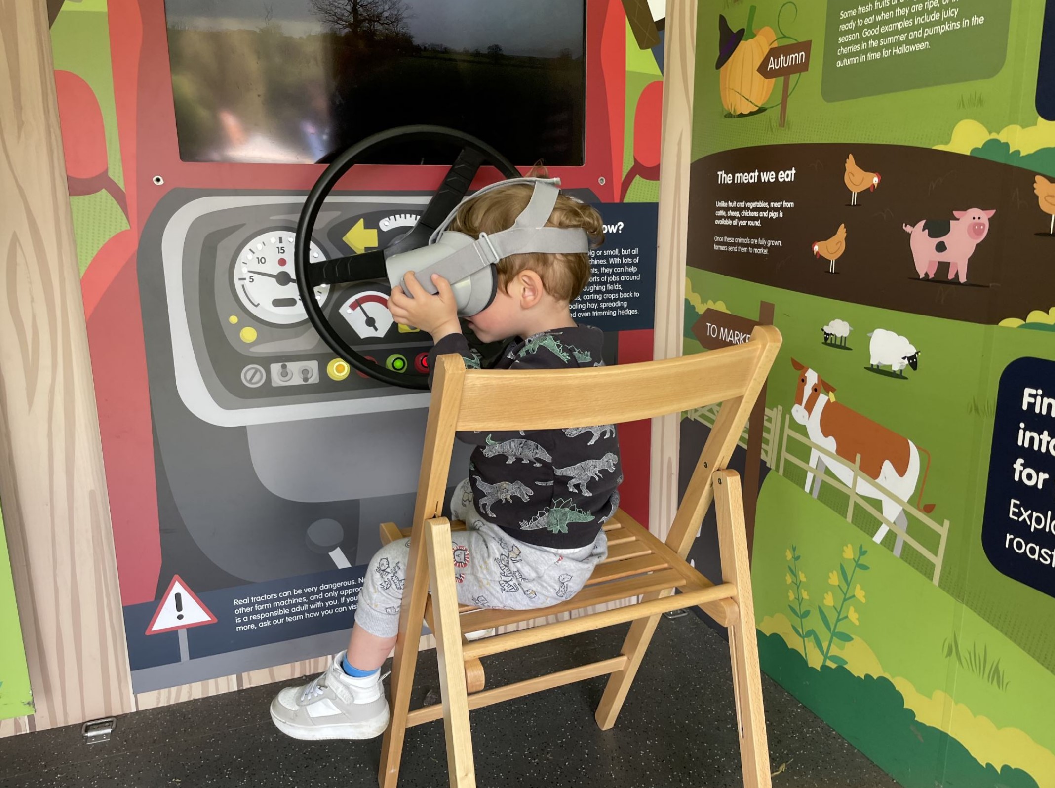A young boy uses the virtual reality headset to learn about food and farming at the NFU Discovery Barn at Brighton Foodies Festival
