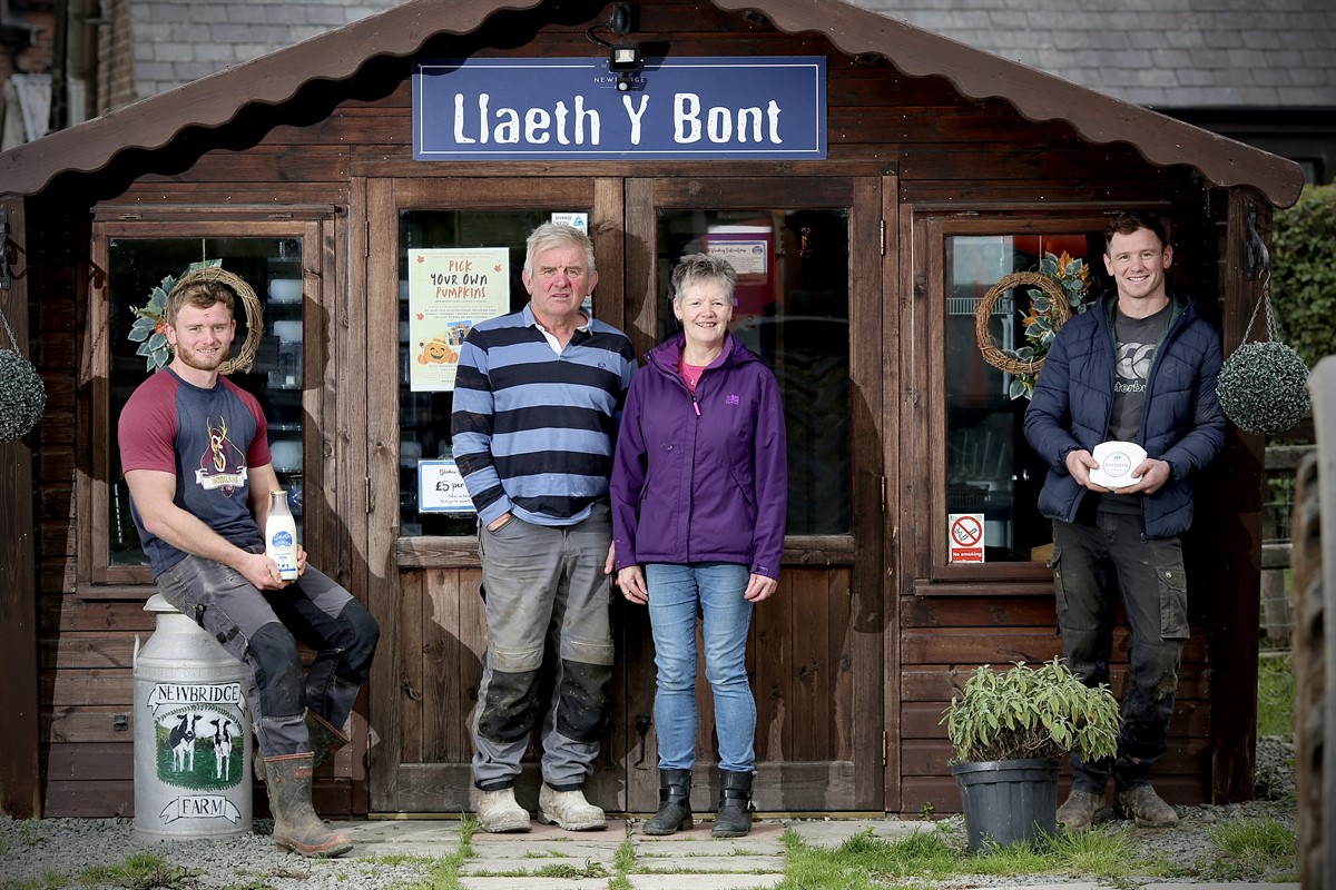 Ieuan Williams and family outside their milk hut