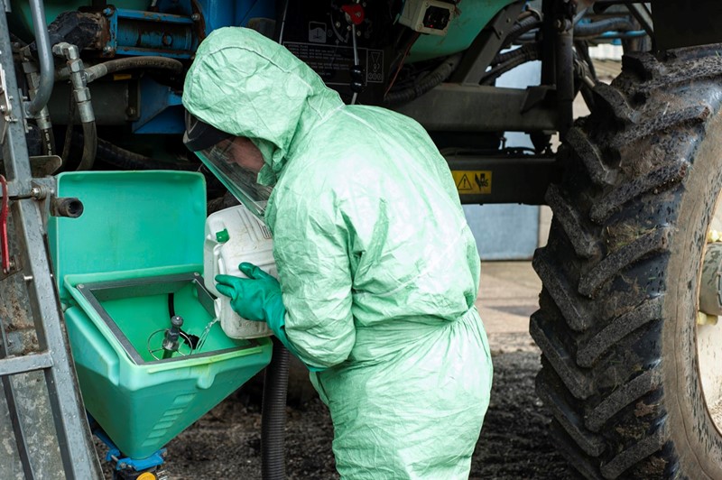 Farm worker using pesticide