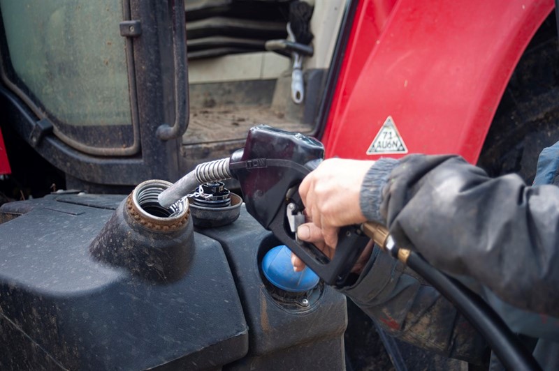 An image showing someone filling a fuel tank