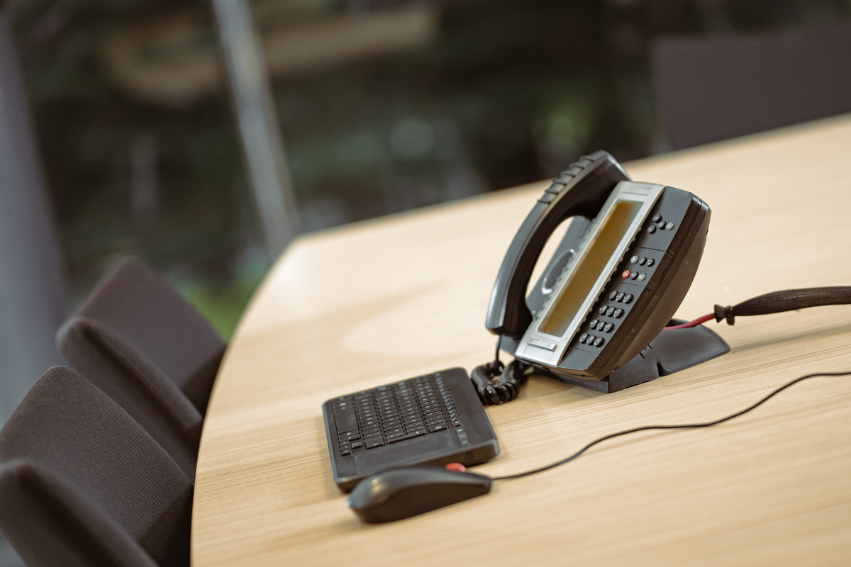 Image shows a telephone on a table
