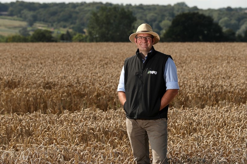 NFU Vice President Tom Bradshaw standing in a field of grain