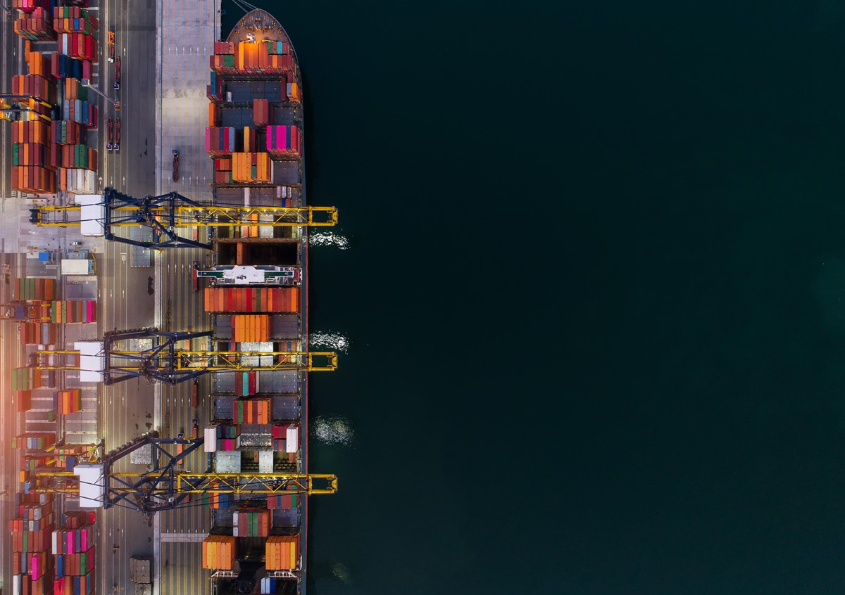 A birdseye view of shipping containers on a large shipping vessel