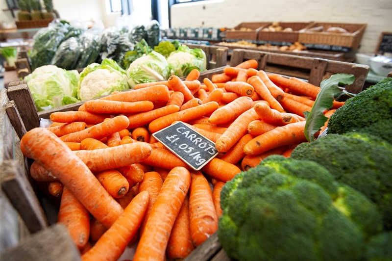 An image showing loose vegetables in a farm shop