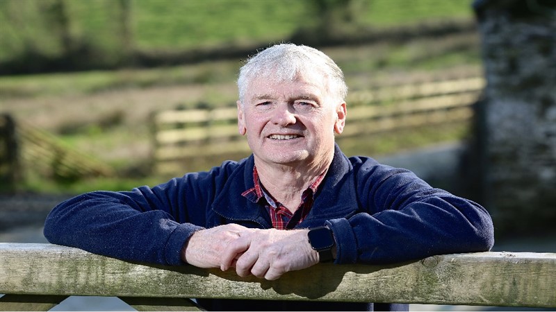 Haydn Evans leaning on gate