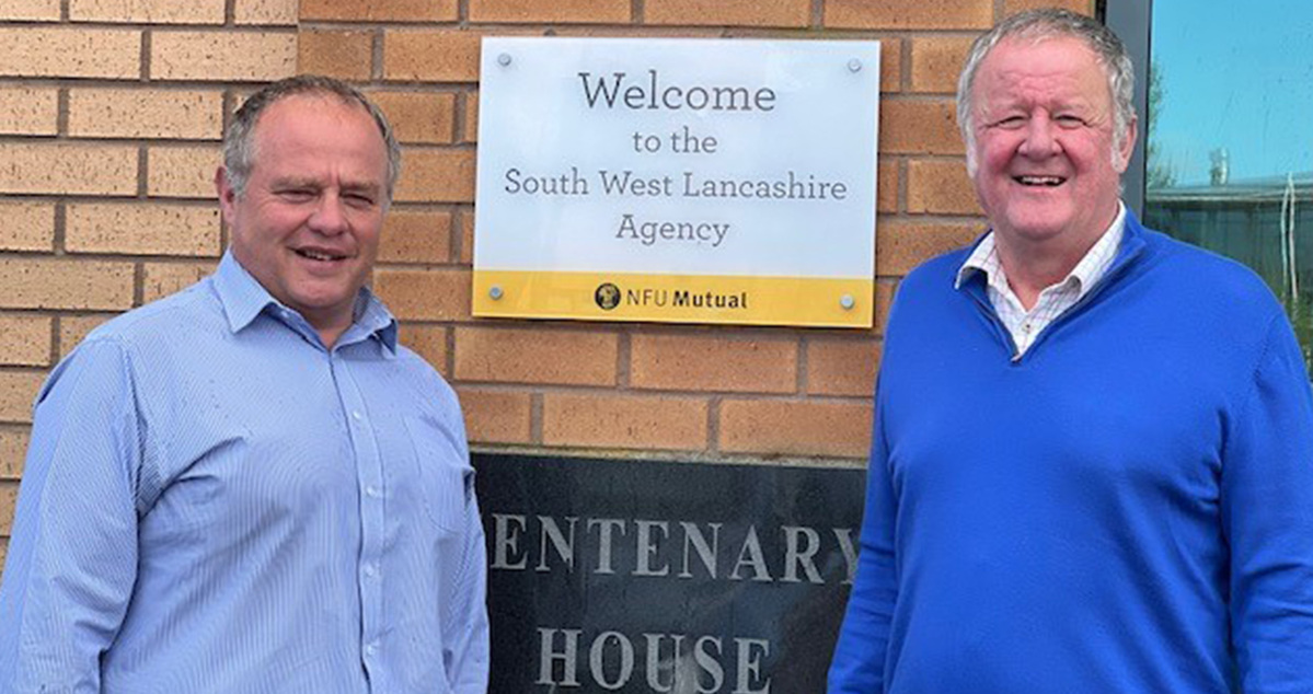 David Shove and Hedley Roberts stood next to the South West Lancashire office sign
