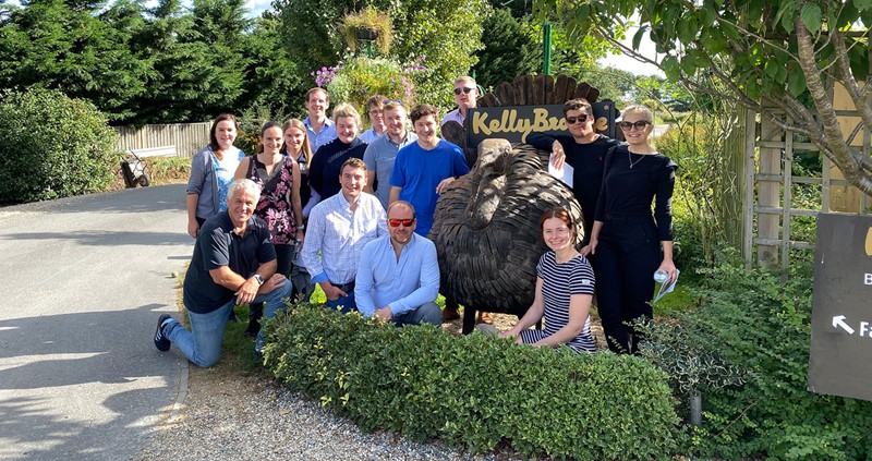 A photo of the Poultry Industry Programme participants outside the entrance of KellyBronze Turkeys.