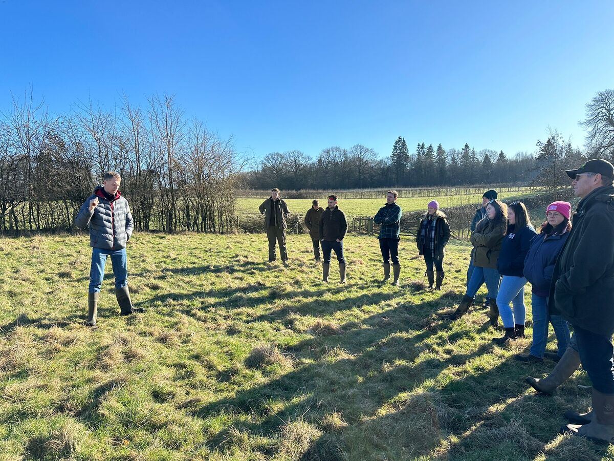 Young farmers standing in a field