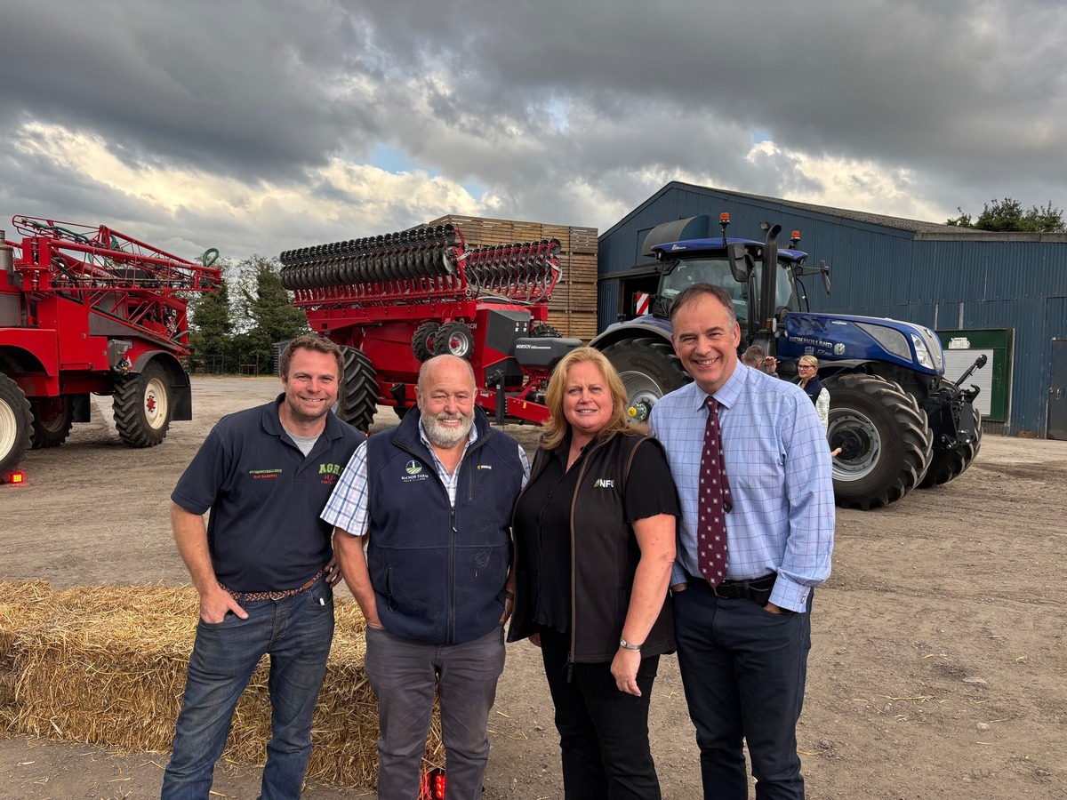 A photo of Olly Harrison, Bill Webb, NFU Vice-president Rachel Hallos and BBC North West Tonight presenter Roger Johnson on farm
