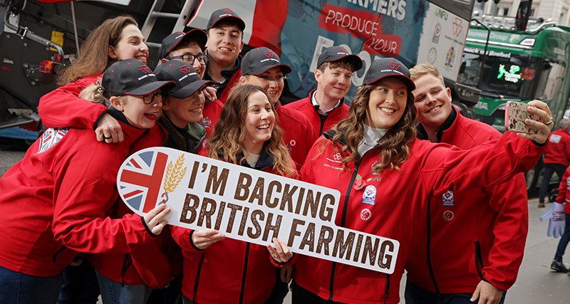 NFU student ambassadors waving back british farming signs