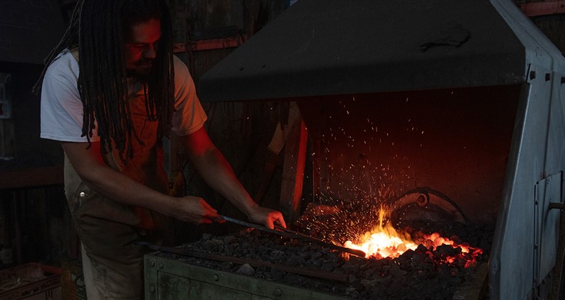 Blacksmith Daniel Johnson at work