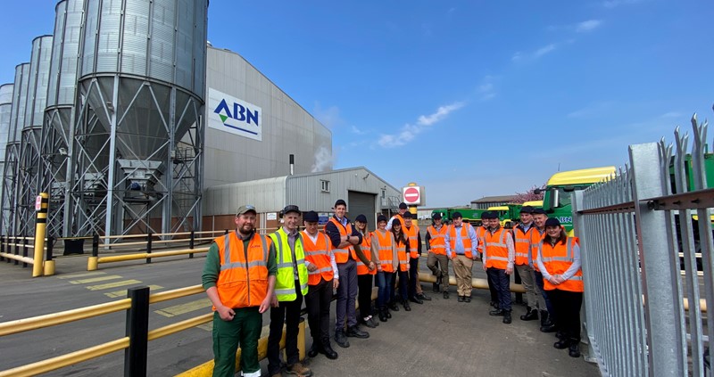An image of the Poultry Industry Programme 2022/23 participants outside ABN Mill. They are pictured wearing orange hi-vis vests.