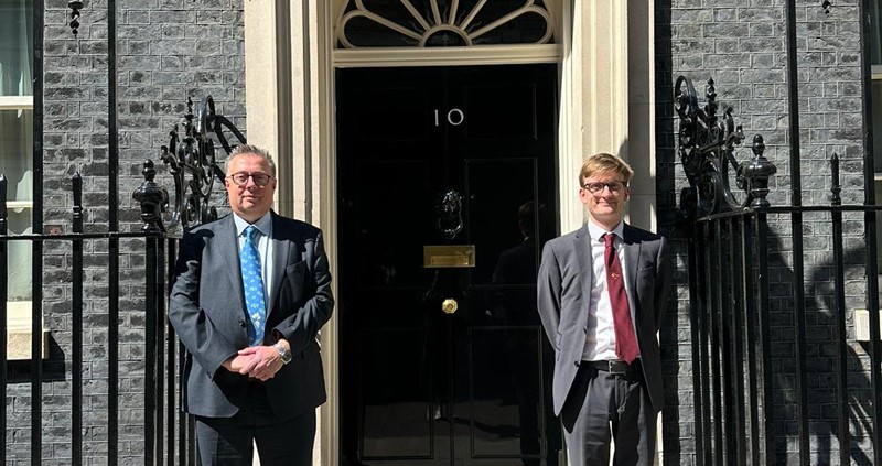 An image of Michael Sly and Arthur Marshall stood outside 10 Downing Street