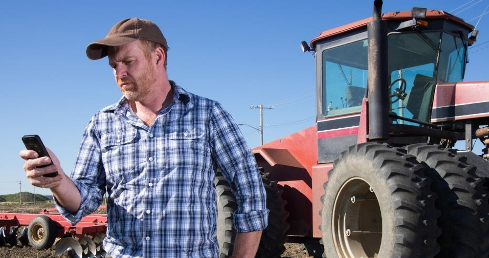 Farmer using a mobile phone, digital, yearbook, March