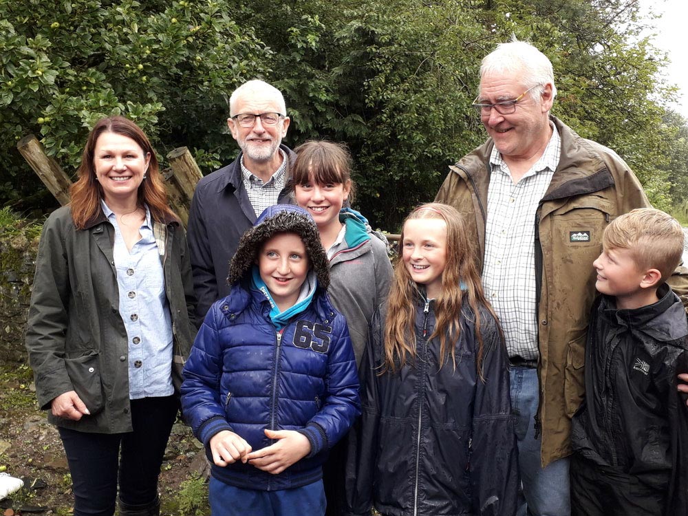 Will Cockbain, Jeremy Corbyn and Sue Hayman on farm in Cumbria