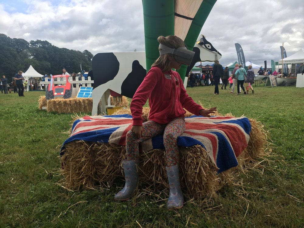 A photograph of a young girl using the NFU&#039;s virtual reality headset