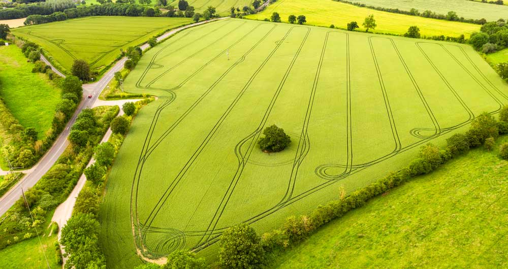 An aerial view of fields separated by traditional hedges and rural roads, in the East Midlands of England.