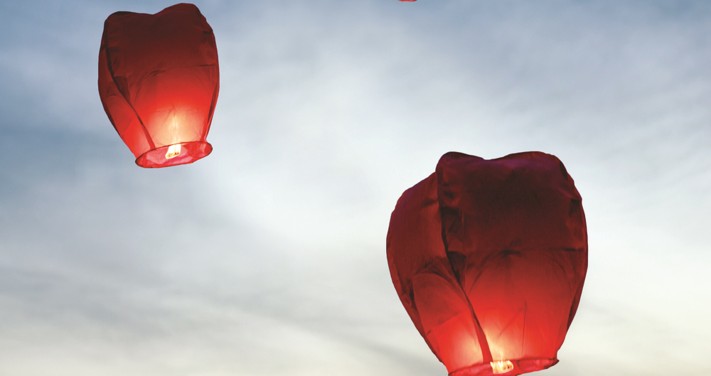 Three sky lanterns in the sky