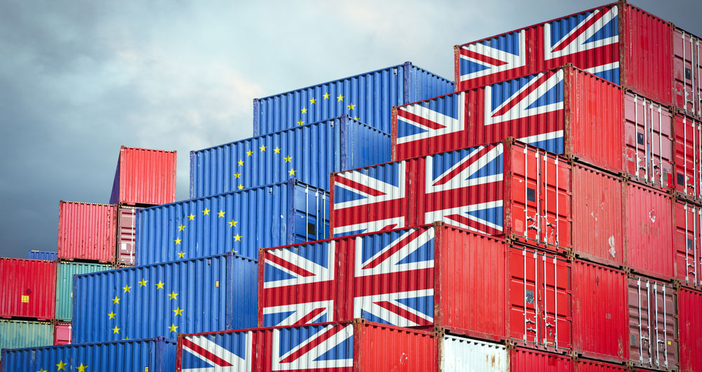 Shipping crates wih EU and UK flags