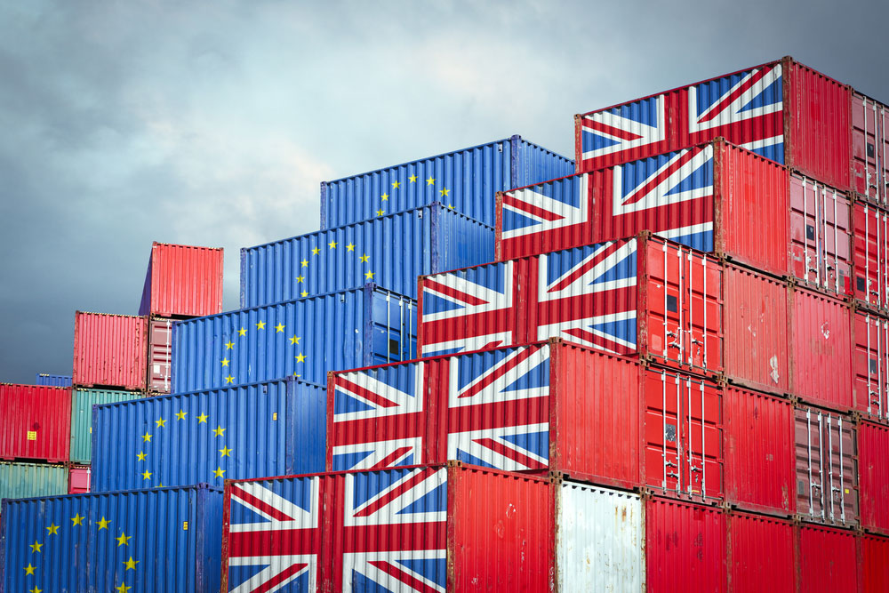 Shipping crates wih EU and UK flags
