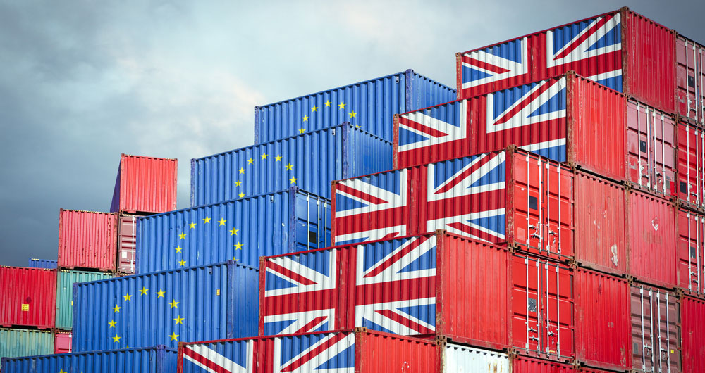 Shipping crates wih EU and UK flags