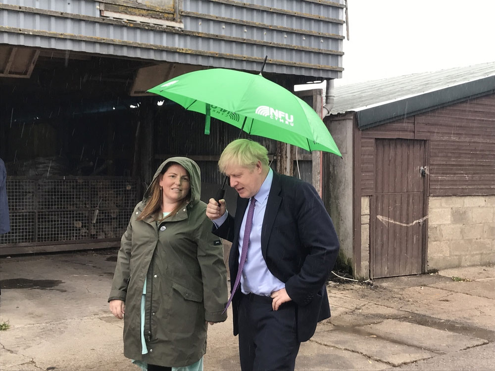 A photograph of Prime Minister Boris Johnson with Victoria Shervington-Jones at her family-owned egg business on the Gwent Levels, west of Newport, south Wales