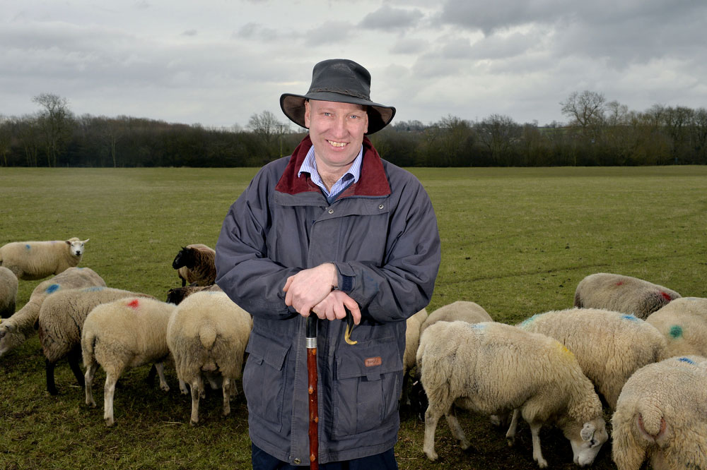 An image of NFU member Charles Sercombe pictured with sheep on farm 