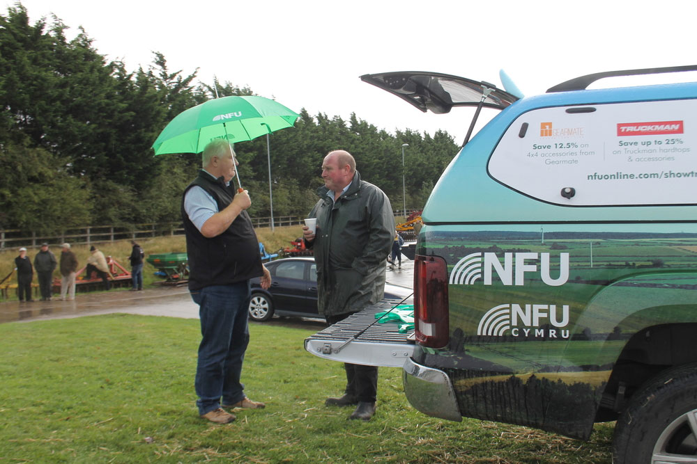 NFU Midlands business manager Nigel Pearson speaking with St Martins farmer Ted Jackson at the affinity roasdshow event at Halls Shrewsbury Livestock Market