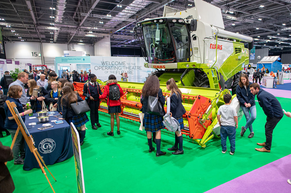 Anna Hunt and George Biss, NFU Student and Young Farmer Ambassadors, talking to school children at the Future of Farming, NS Live, Excel, 10th October 2019