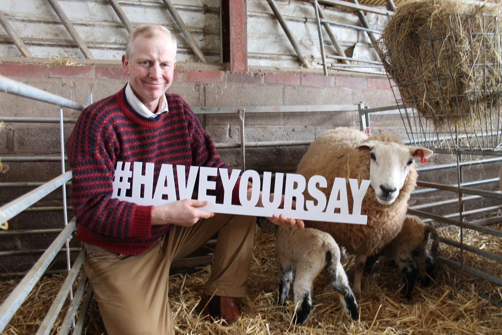 Richard Yates on farm with sheep and #haveyoursay sign