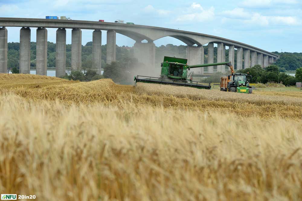 <h4>Harvesting beside Orwell Bridge</h4><p>A combine harvester in action in late July 2019, harvesting the field next to Suffolk Food Hall, overlooking the River Orwell and in the shadow of Orwell Bridge. Photo: Nikon D4 + 80-200mm F2.8 92mm 1/800 @ F8 ISO 250</p><p>Warren’s comments: </em>This shot was done at just 15 minutes notice, just as I was meeting my Mum for coffee elsewhere in Ipswich. We both jumped in my car and charged over to Wherstead to get the images.</em></p>