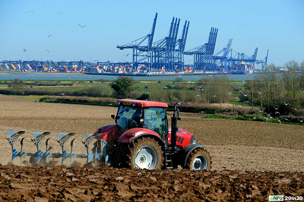 <h4>Ploughing at Shotley</h4><p>Farmer Andrew Packard ploughing land overlooking the Port of Felixstowe in March 2020. Photo: Nikon D4 + 80-200 F2.8 (105mm) 1/800 @ F8 ISO 160</p><p>Warren’s comments: <em>I wanted a shot featuring the Port of Felixstowe and had scouted out the best view on GoogleEarth before heading down to Shotley. Once I’d found the right field, I went looking around farmyards for somebody to ask and luckily got landowner Andrew Packard first time around. Unfortunately, the chosen field was waterlogged for the next three months but my patience paid off in the end.</em></p>