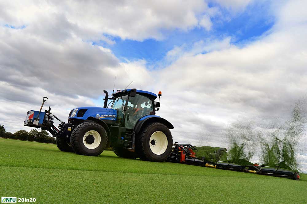 <h4>Mowing turf at Sutton Hoo</h4> <p>Turf being mowed on fields next to the Sutton Hoo burial site near Woodbridge. Sovereign Turf has been producing grass commercially for more than 30 years. Photo: Nikon D4 + 24mm F2.8 1/2000 @ F5 ISO 500</p> <p>Warren’s comments: <em>The aim of this shot was to get the flying grass cuttings. This meant lying down on the pristine new turf with a wide-angle lens, while the driver passed as close to me as he dared.</em></p>