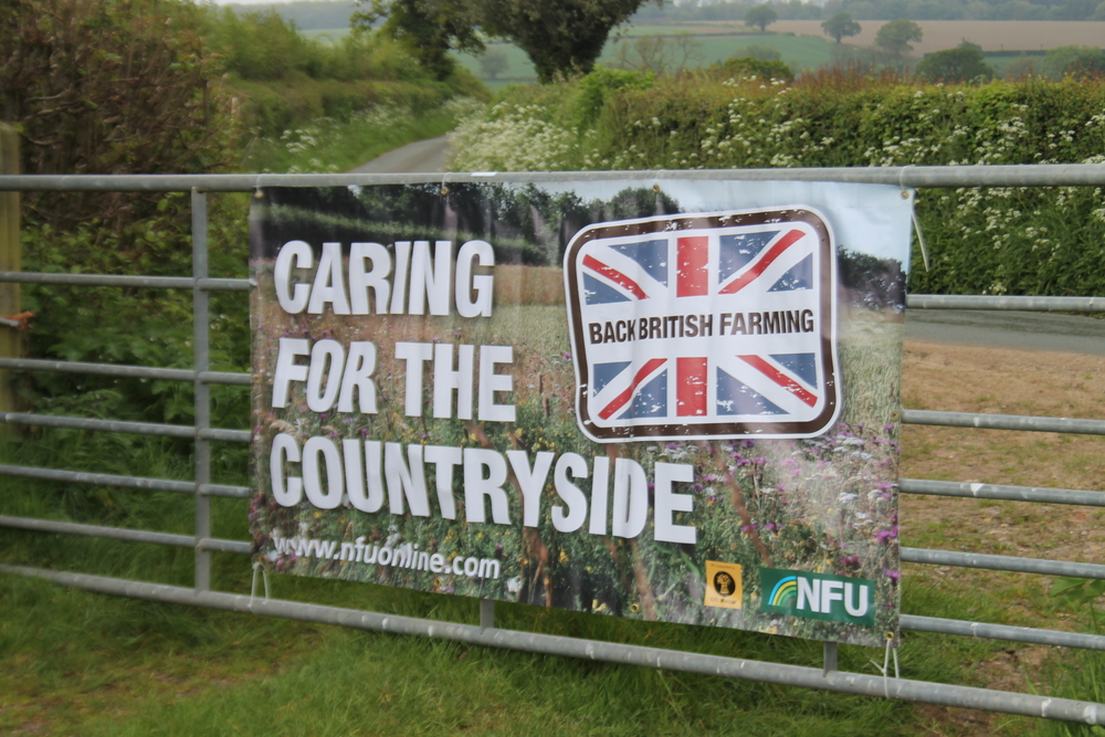 NFU care for the countryside banner at the Farm Nature Discovery Day, Onibury, 2019, at Rob Alderson's farm