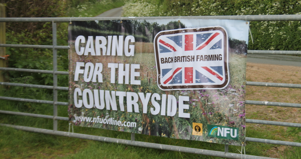 NFU care for the countryside banner at the Farm Nature Discovery Day, Onibury, 2019, at Rob Alderson's farm